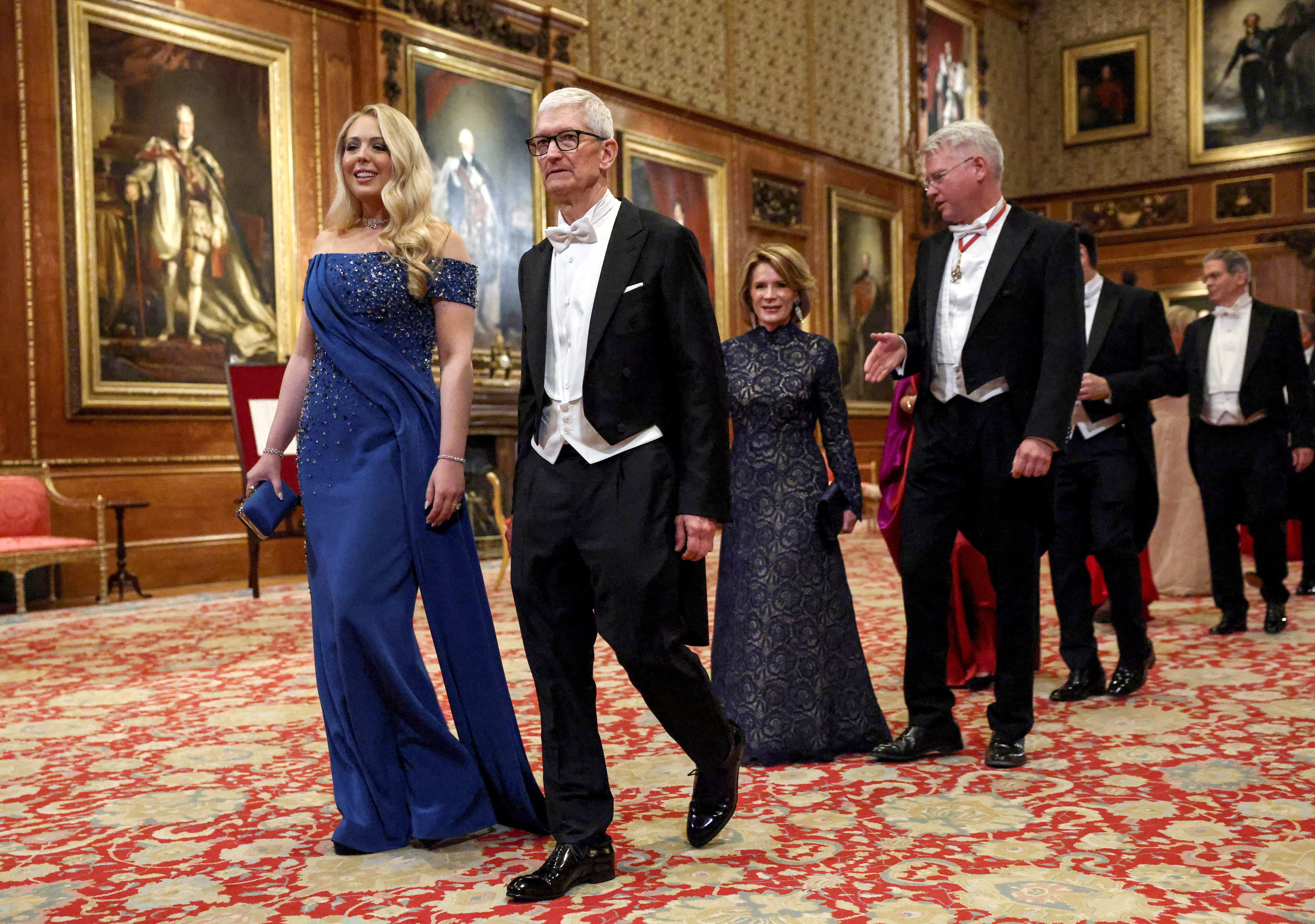 Apple CEO Tim Cook and Tiffany Trump walk to attend the state banquet, followed by Harriet Stephens and Charles Woodburn, CEO of the aerospace company BAE Systems