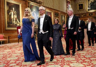 Apple CEO Tim Cook and Tiffany Trump walk to attend the state banquet, followed by Harriet Stephens and Charles Woodburn, CEO of the aerospace company BAE Systems