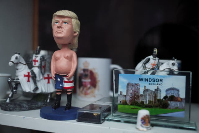 <p>A figurine of U.S. President Donald Trump trump is displayed for sale in the window of a souvenir shop on the day of the state visit of U.S. President Donald Trump and First Lady Melania Trump to the UK, in Windsor, Britain, September 17, 2025. REUTERS/Phil Noble</p>