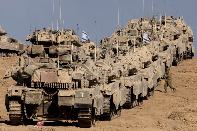 <p>Tanks stationed in southern Israel near the border with the Gaza Strip on 17 September </p>