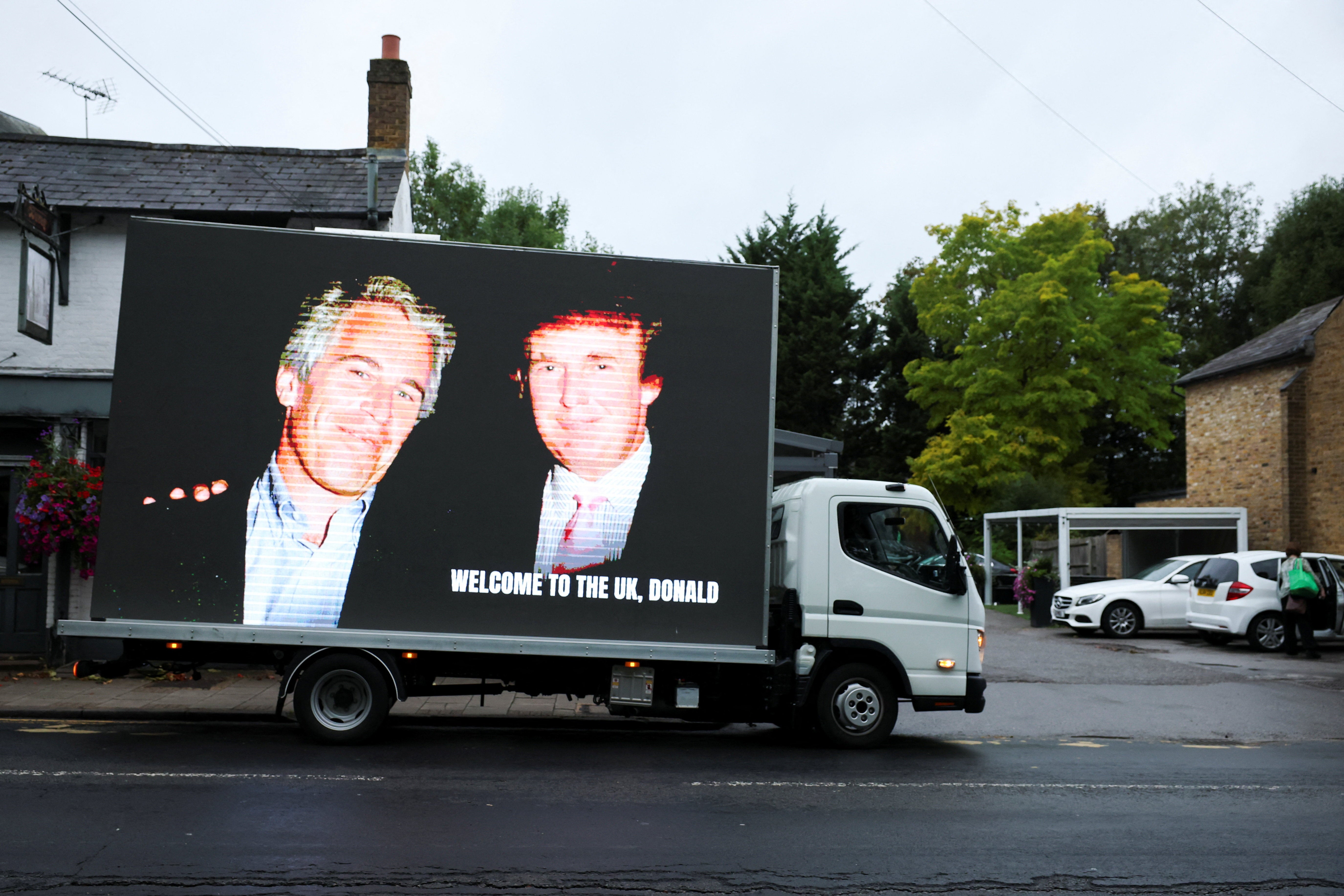 Donald Trump, an image of Donald Trump, along with the infamous financier Jeffrey Epstein, is displayed on a vehicle in Windsor on the first day of the US president's visit to the kingdom.