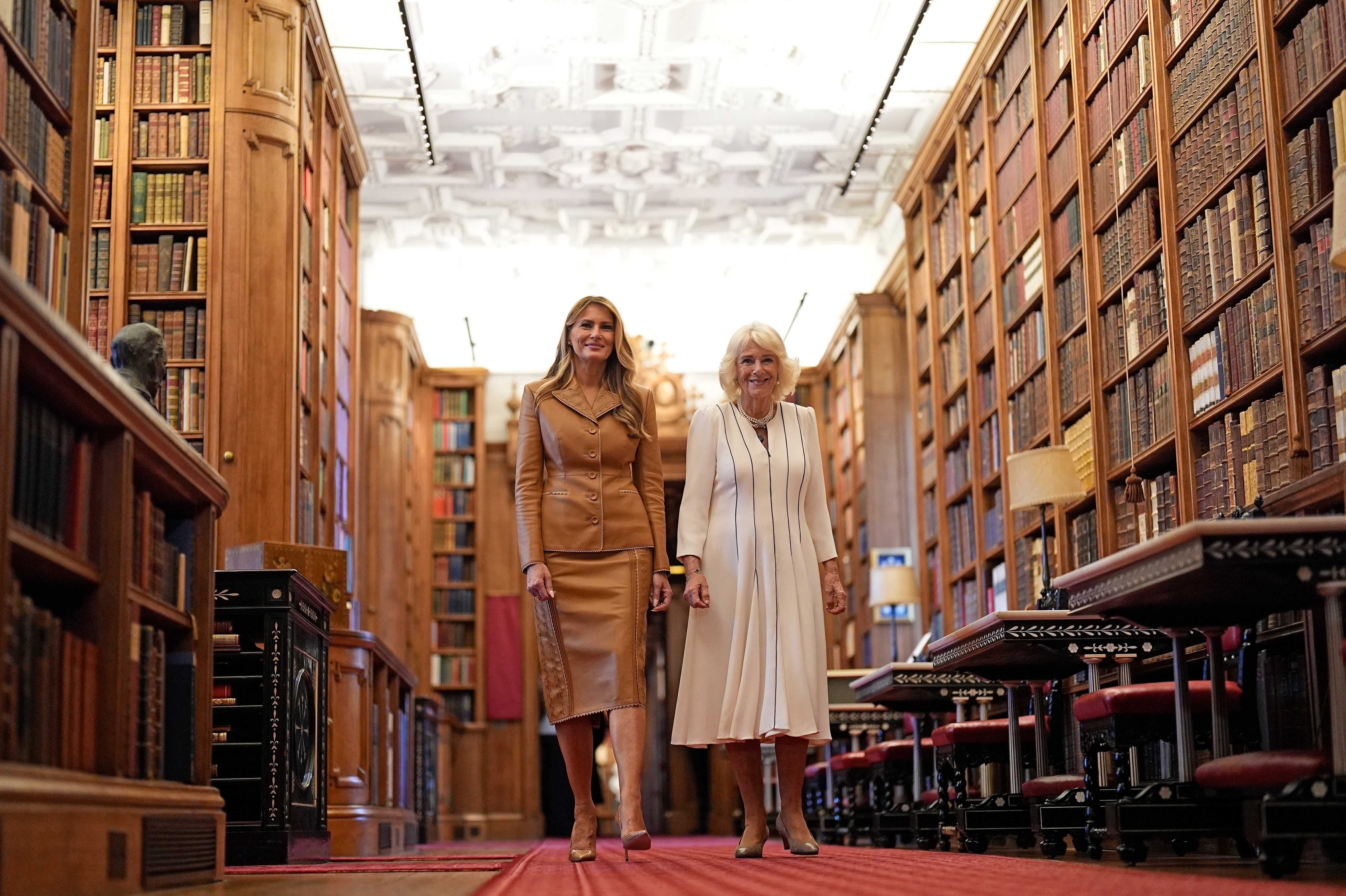 Queen Camilla (right) and First Lady Melania Trump view the Royal Library at Windsor Castle