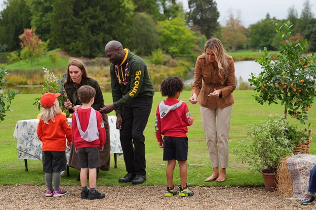 <p>The Princess of Wales (left) and First Lady Melania Trump present "Go Wild" badges as they meet members of the Scouts' Squirrels programme in Frogmore Gardens in Windsor</p>