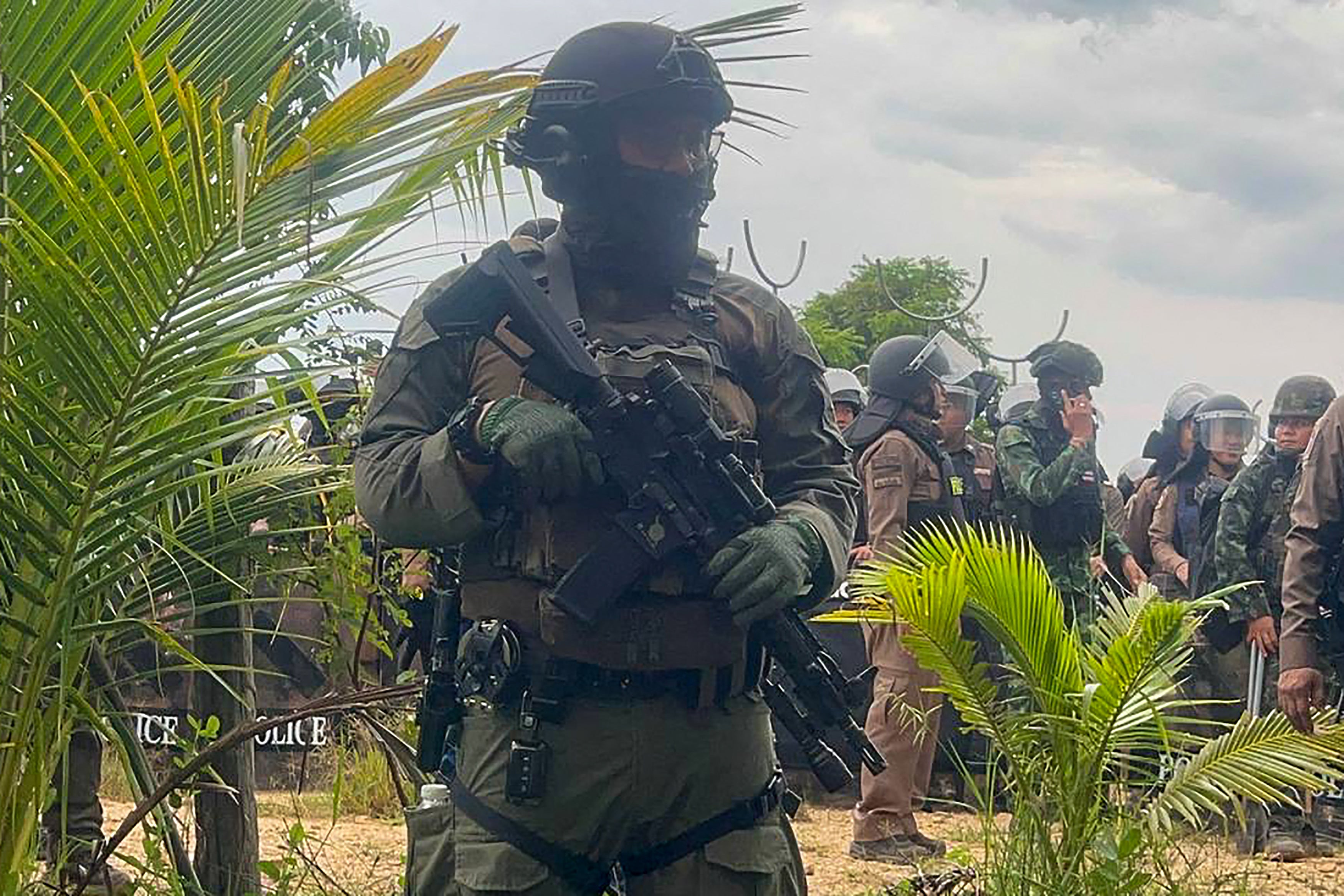 Thai soldier stand guard in a disputed area along the border with Thailand