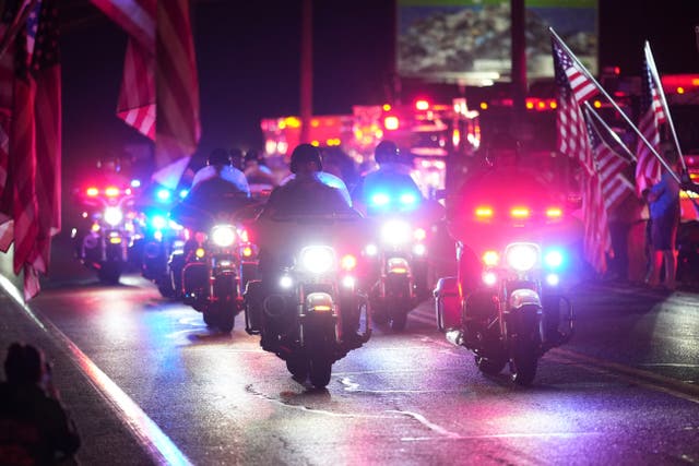 <p>Police officers ride during a procession Wednesday, Sept. 17, 2025, in Spring Grove, Pa., after multiple police officers were shot and killed. (AP Photo/Matt Slocum)</p>