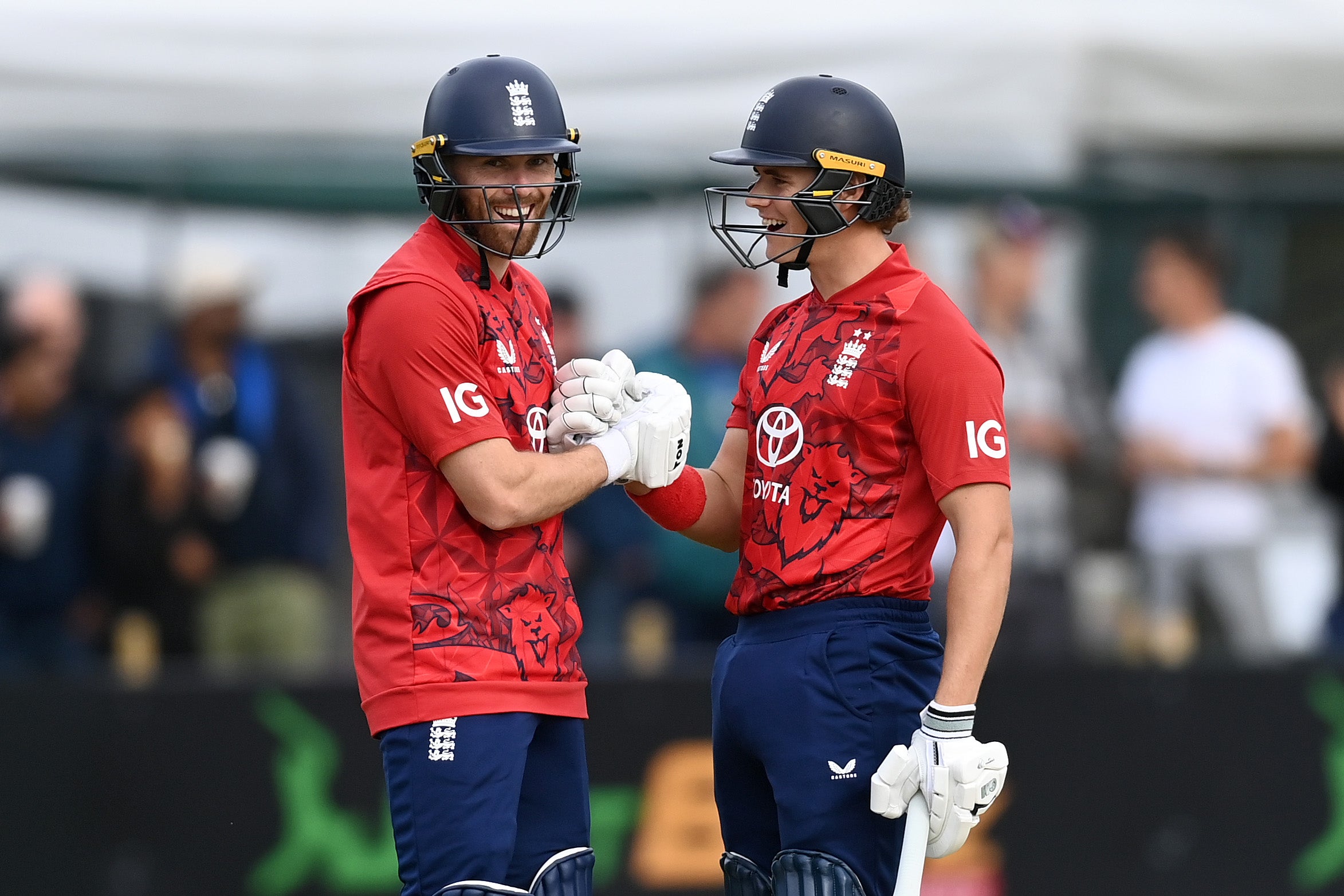 <p>Phil Salt of England celebrates reaching his half century with captain Jacob Bethell during the first T20 International match between Ireland and England </p>