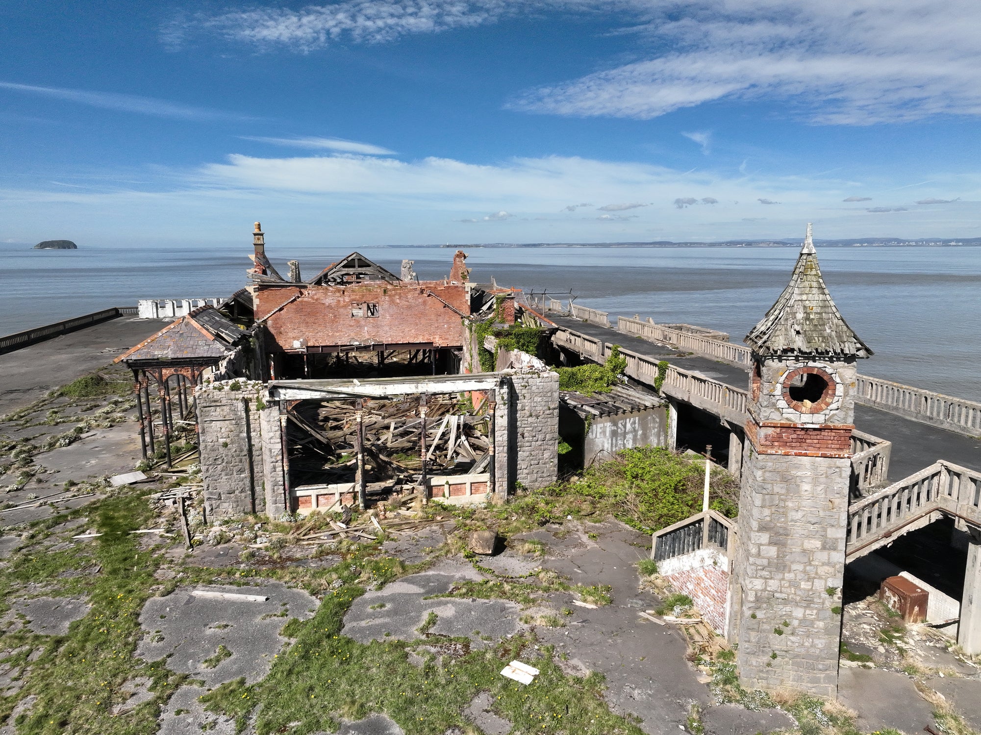 <p>The derelict building and clock tower on Birnbeck Pier, Weston-super-Mare</p>