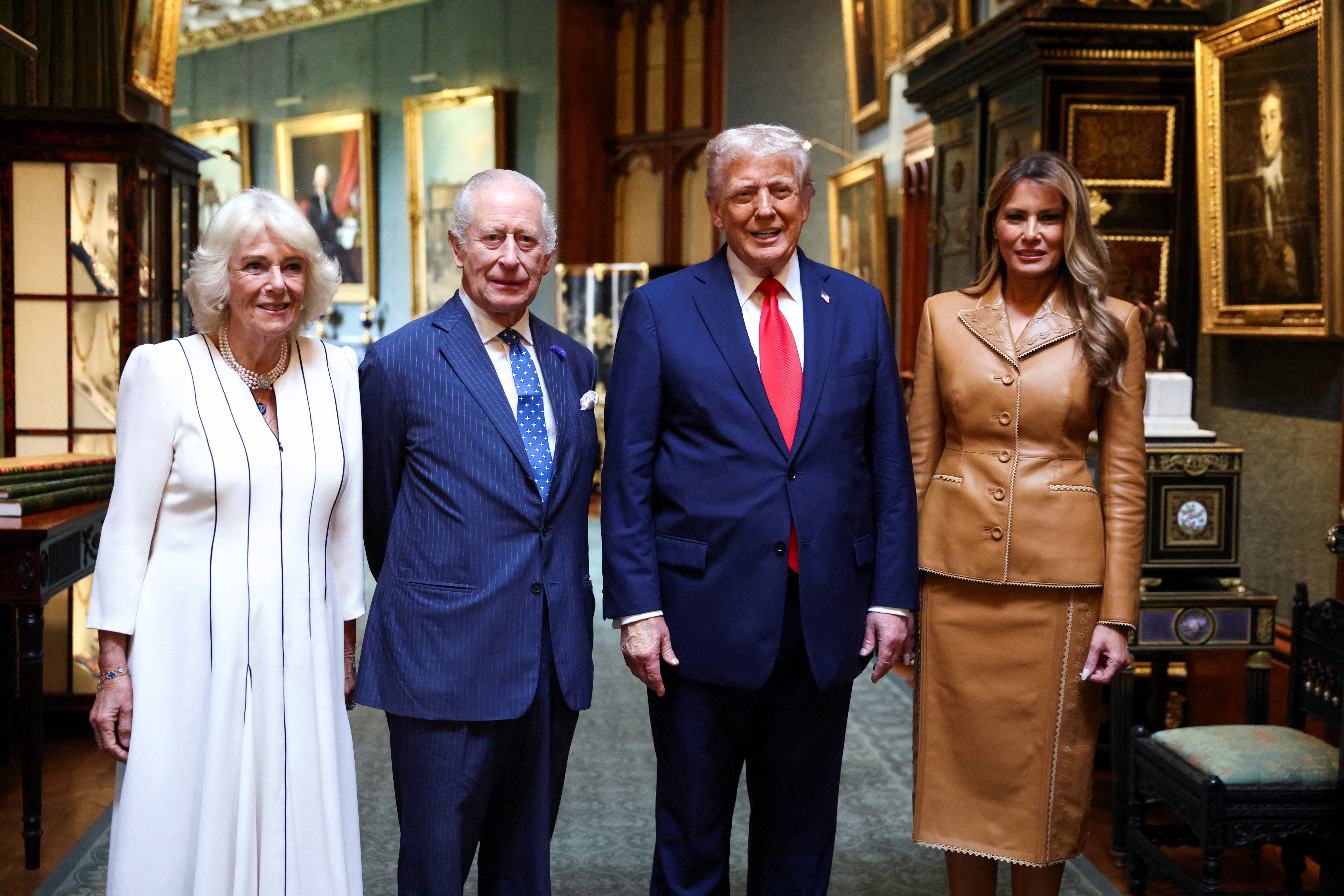 US President Donald Trump and first lady Melania Trump stand next to Britain's King Charles and Queen Camilla in the Grand Corridor in Windsor Castle as they bid their farewells
