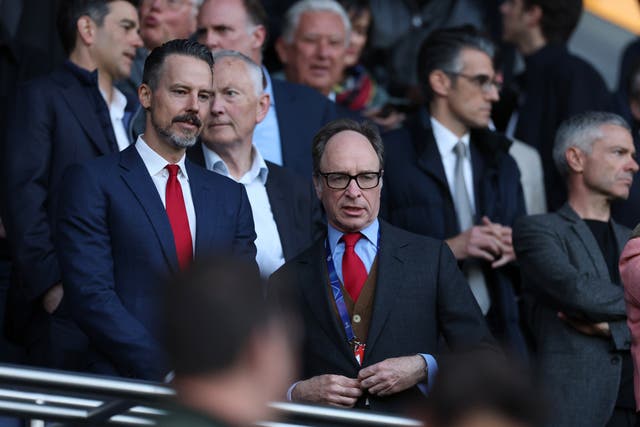 <p>Tim Lewis with Josh Kroenke, director of Arsenal, at the Champions League semi-final against Paris Saint-Germain</p>