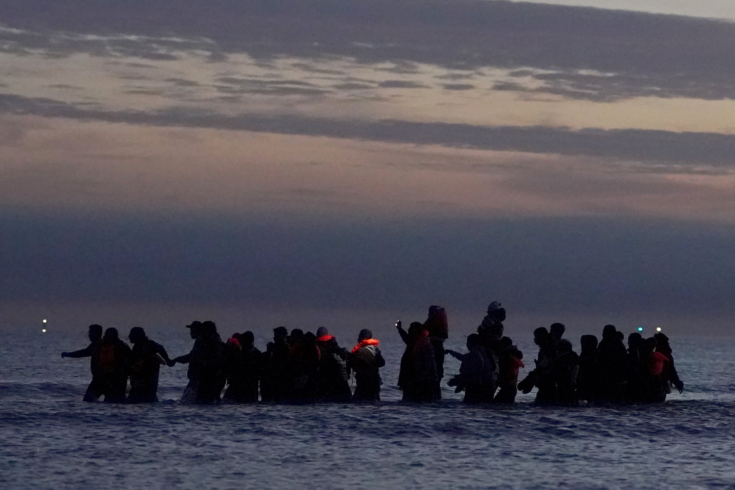 A small boat carrying people thought of migrant near Gravelin in France on Friday.