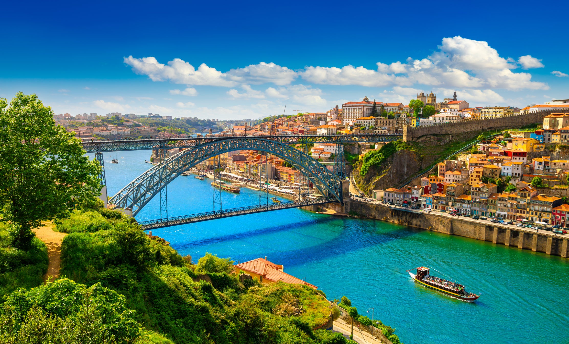 Porto is the second stop on our Portugal city escape itinerary. Pictured is the breathtaking Dom Luís I Bridge