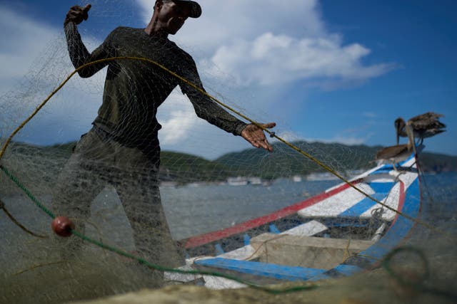APTOPIX Venezuela Fishing Community