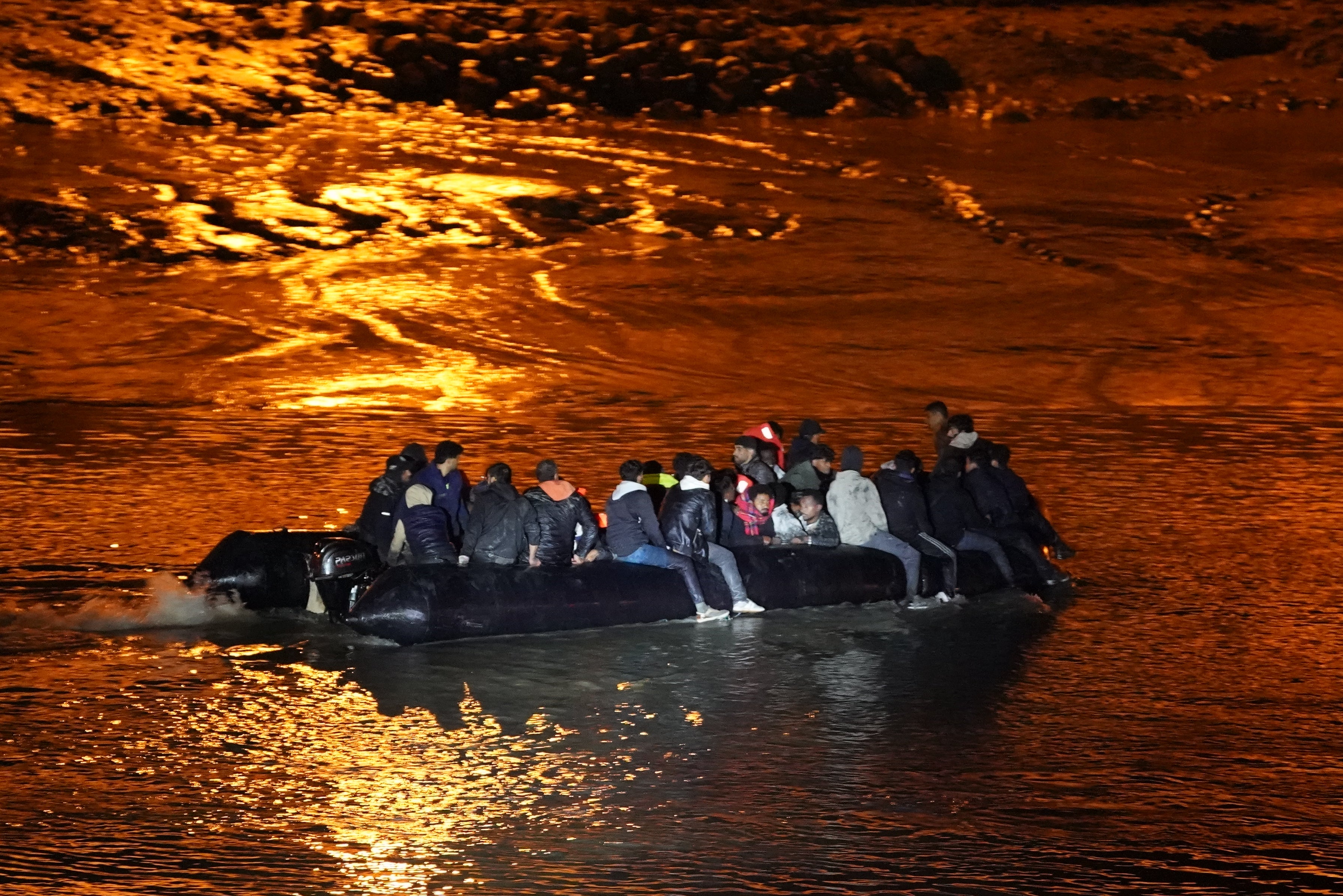 A small boat carrying people was a migrant near the French coast on Friday morning