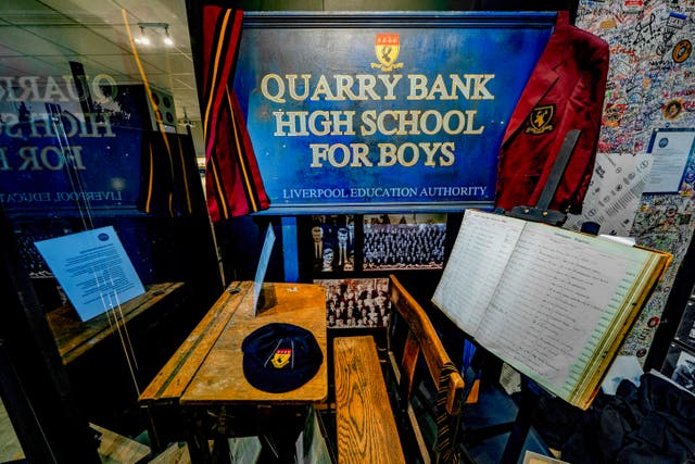 <p>The school desk of former Beatles frontman John Lennon and the Quarry Bank High School ledger goes on display at The Beatles Museum</p>