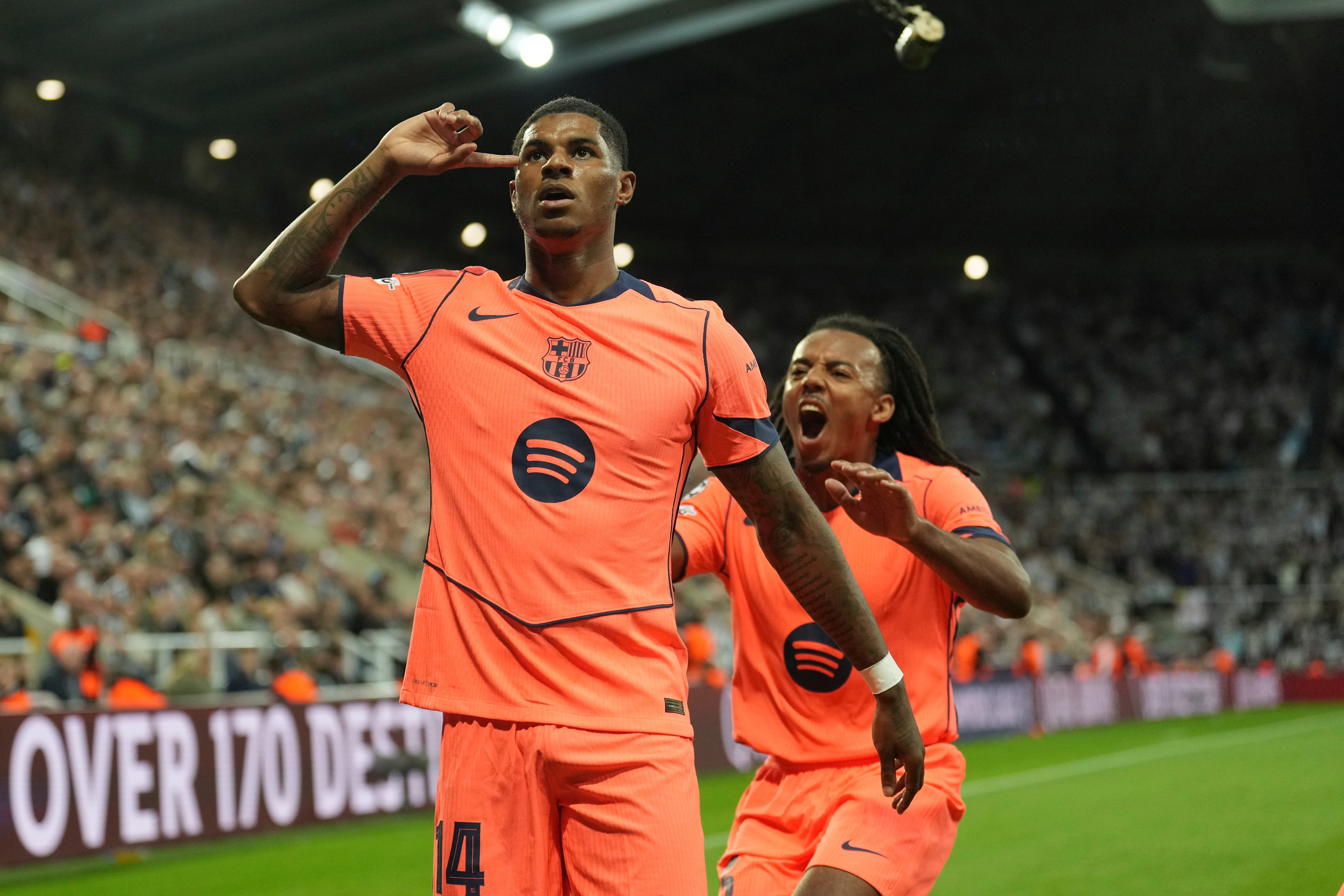 <p>Barcelona's Marcus Rashford, left, celebrates after scoring his side second goal with Jules Kounde during the Champions League</p>