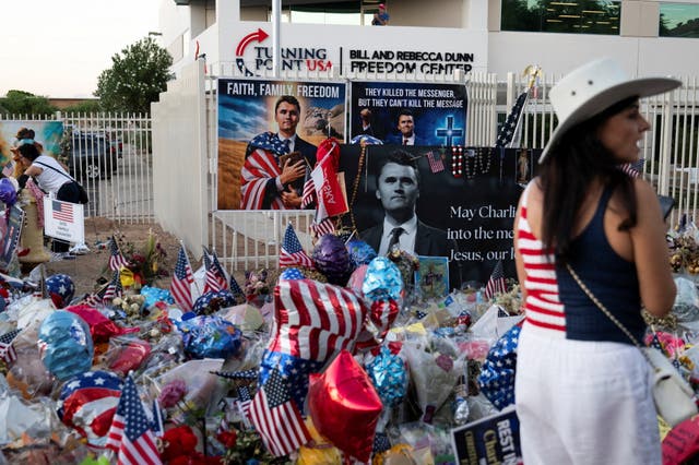 <p>A supporter attends a vigil in memory of right-wing activist Charlie Kirk who was fatally shot during an event at Utah Valley University, outside the headquarters of Turning Point USA in Phoenix, Arizona, U.S. September 19, 2025</p>