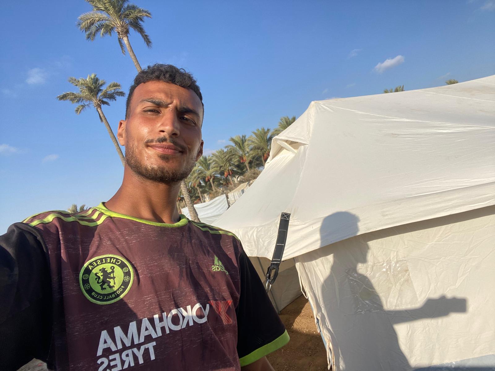 Qasem Jamil Qasem, 23, has been displaced for the third time and is seen here having pitched his tent in the south of Gaza after a gruelling 13-hour journey
