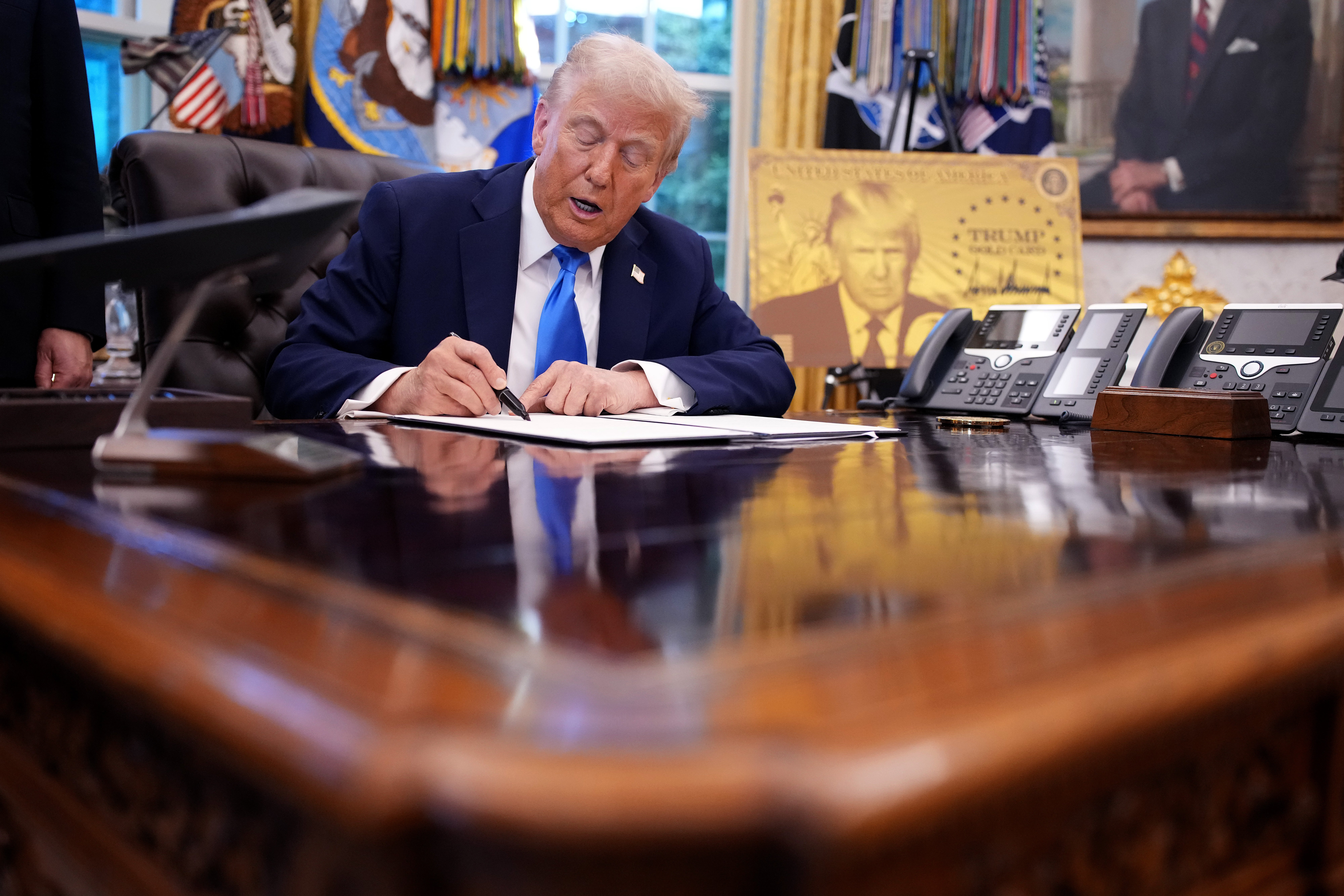 Trump signed a proclamation Friday imposing a $100,000 annual fee on H-1B visa applications.