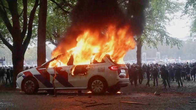 Violence erupts at right-wing demonstration in the Netherlands ahead of election | The Independent