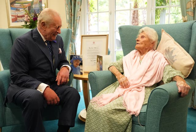 <p>King Charles III meets the world’s oldest person, 116-year-old Ethel Caterham, at Hallmark Lakeview Care Home in Lightwater, Surrey</p>