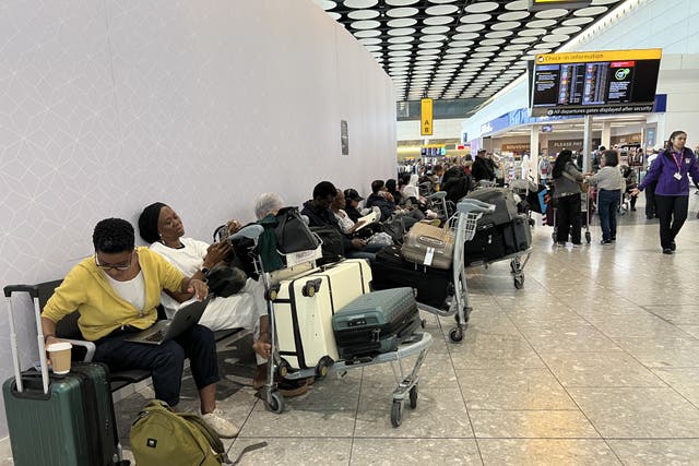 <p>Waiting game: Passengers at London Heathrow Terminal 4, where the effect of the cyber attack is greatest</p>