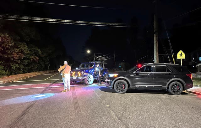 <p>Police block a road to a country club where a shooting happened at Sky Meadow Country Club in Nashua, New Hampshire, Saturday, Sept. 20, 2025. (AP Photo/Michael Casey)</p>