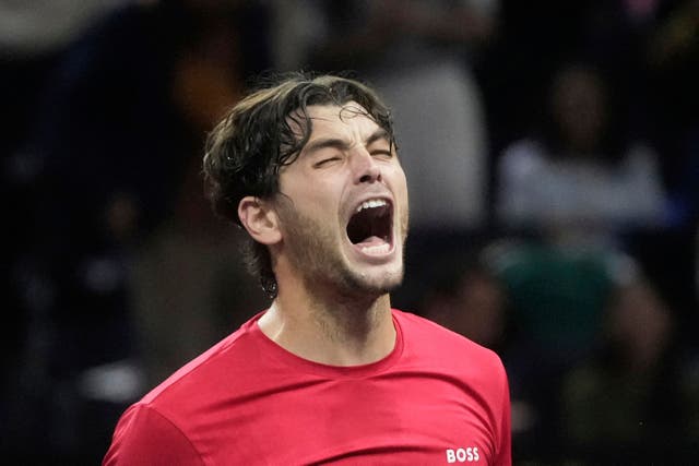 Team World’s Taylor Fritz, of the United States, celebrates after defeating Team Europe’s Carlos Alcaraz (Jeff Chiu/AP)