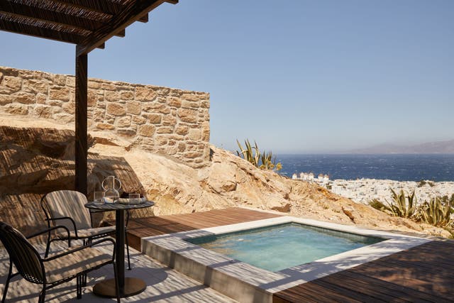 <p>Larger suites at Anandes in Mykonos, Greece have dipping pools overlooking the town and the sea – these are the best hotels in Mykonos, according to our expert</p>