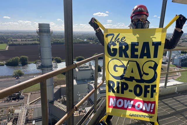 Greenpeace climbers scale two 75m-high chimney stacks at the UK’s second largest gas-fired power station, Staythorpe Power Station. (Greenpeace/PA)