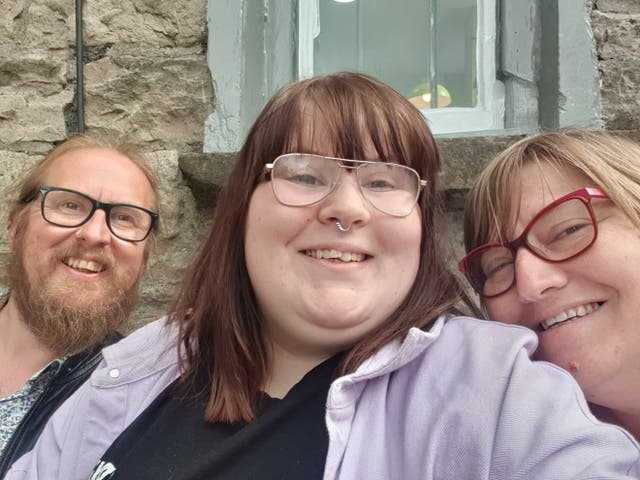 <p>Zoe Nunn (centre), 20, with her parents, Mark Nunn, 52 and Louise Nunn, 49</p>