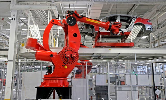 <p>A technician at Tesla's assembly plant in Fremont, California, says an out-of-control robotic arm left him grievously injured.</p>