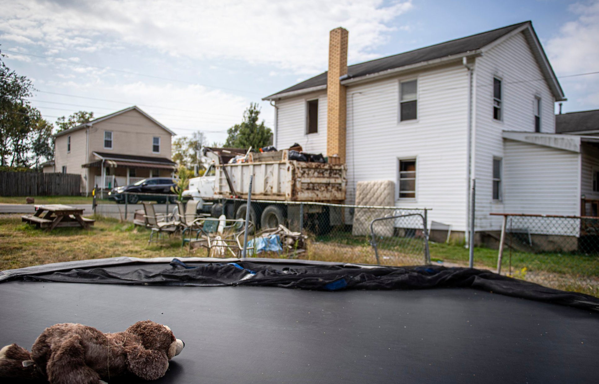 CORRECTION Infants Remains-Woman Charged