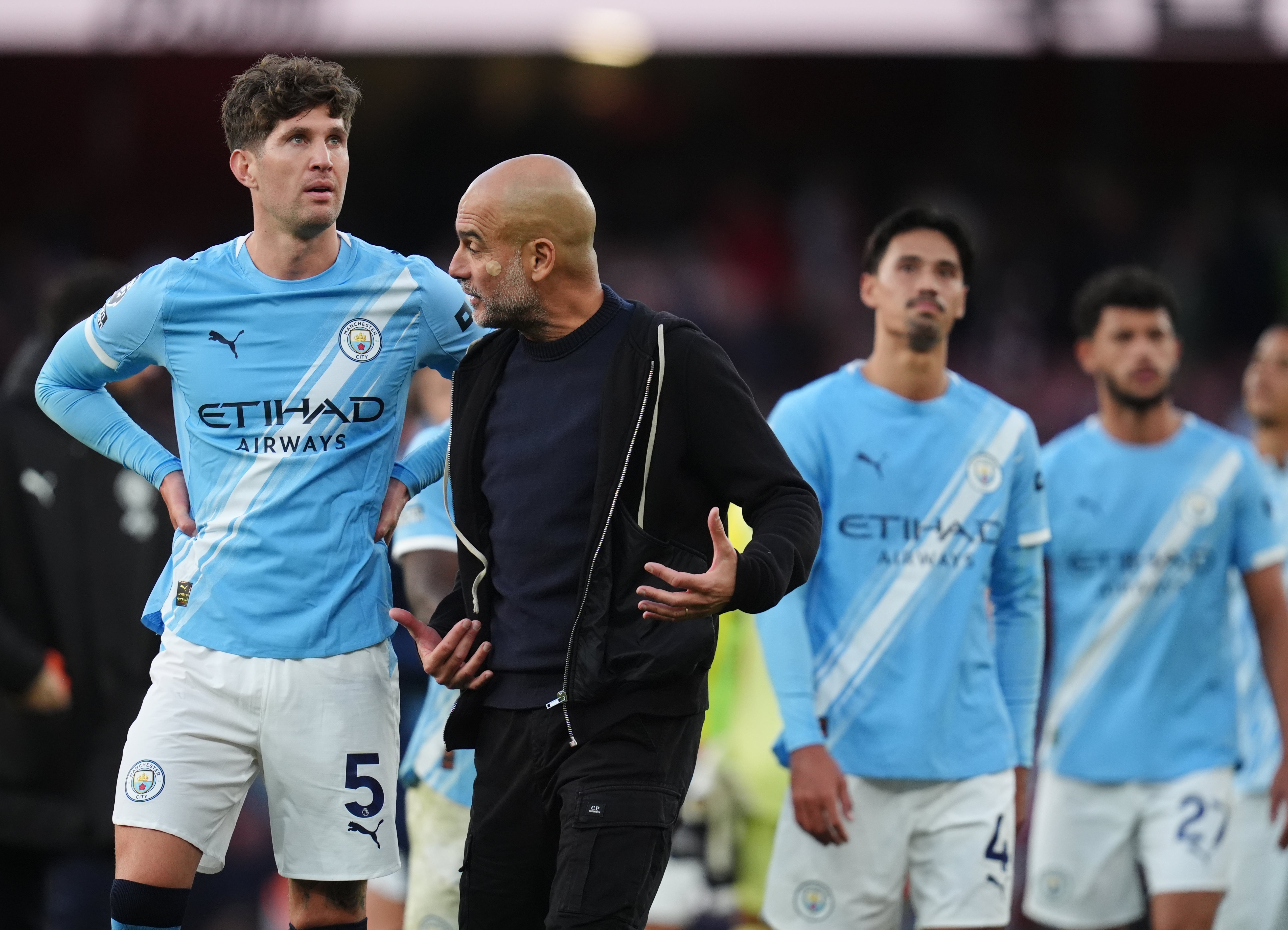 <p>Manchester City manager Pep Guardiola with John Stones </p>