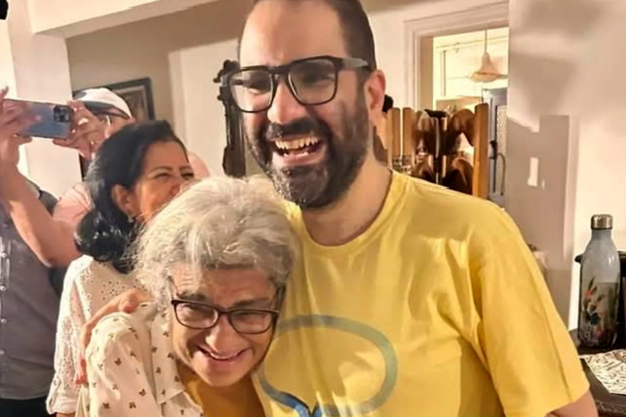 Activist who was jailed in Egypt arrives in UK after travel ban lifted