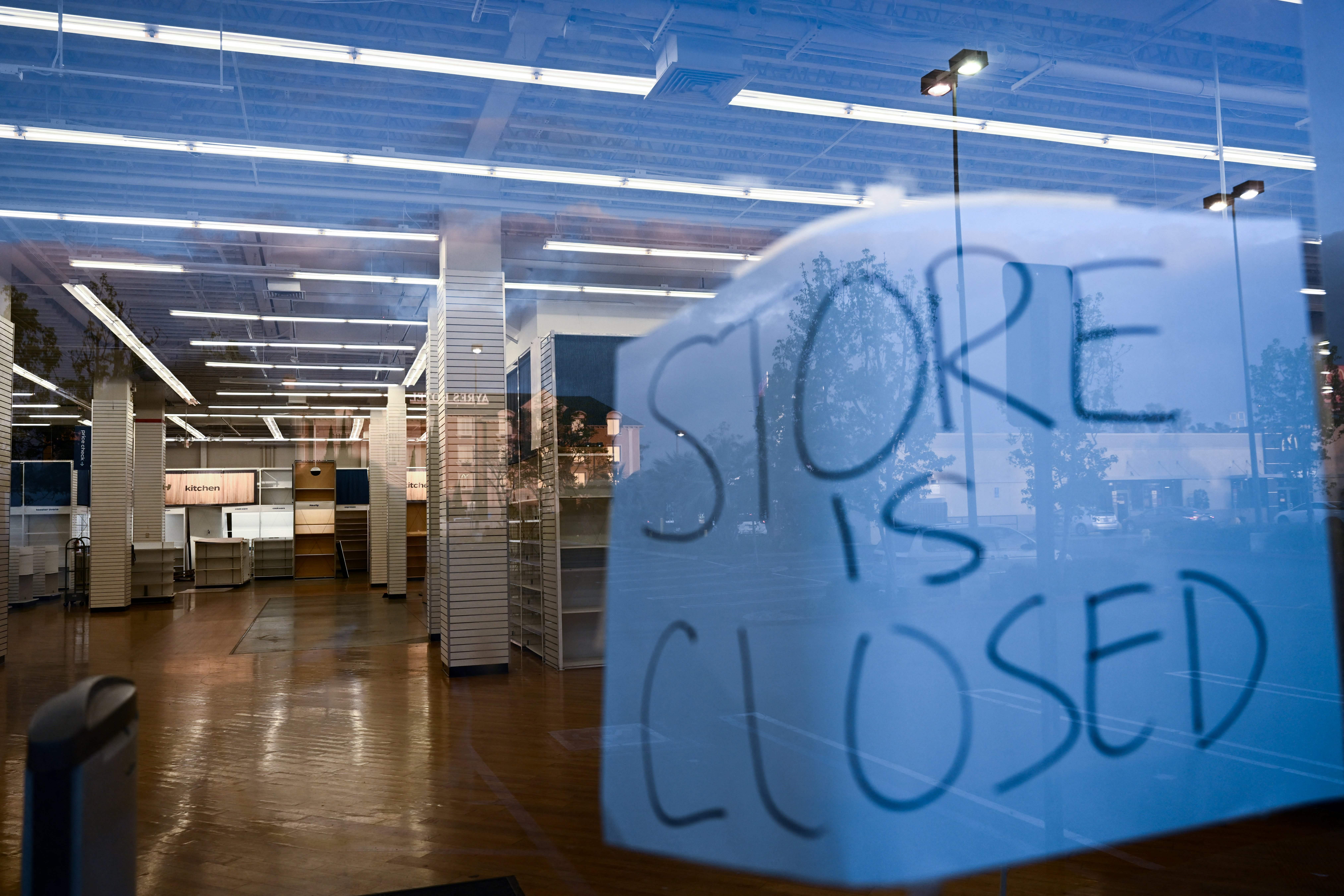Signage is displayed outside a permanently closed Bed Bath & Beyond retail store