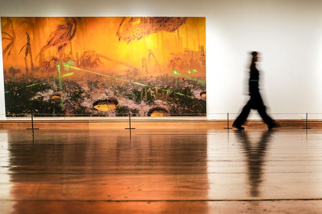A woman views a work by nominated artist Mohammed Sami during the press preview for the Turner Prize 2025 (Danny Lawson/PA)