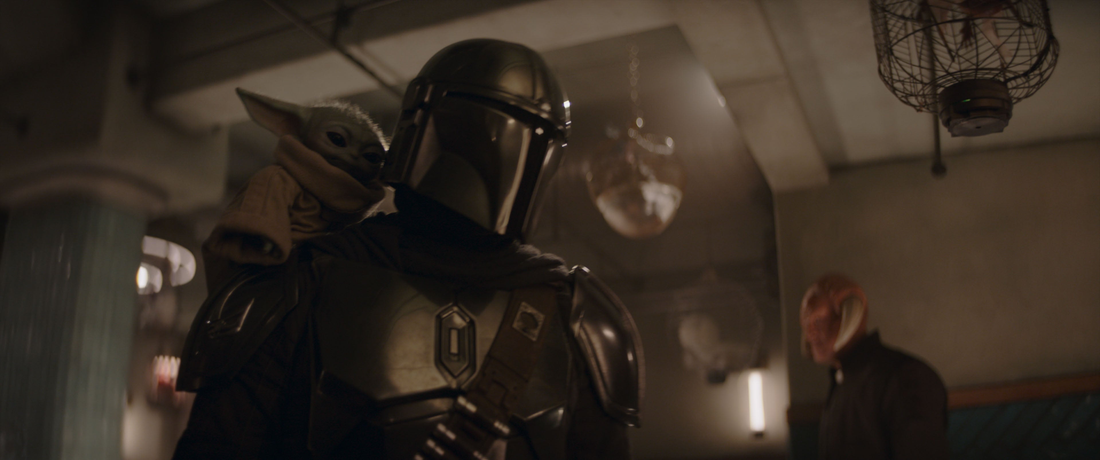 <p>Grogu and Mandalorian (Pedro Pascal) in Lucasfilm's THE MANDALORIAN & GROGU</p>