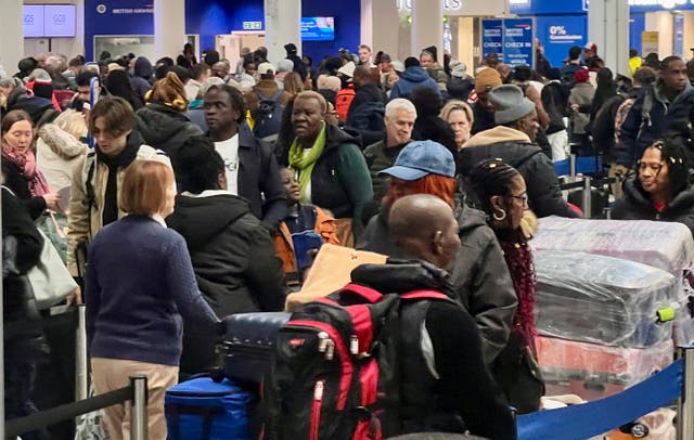 <p>Waiting game: Crowds at South Terminal, Gatwick airport</p>