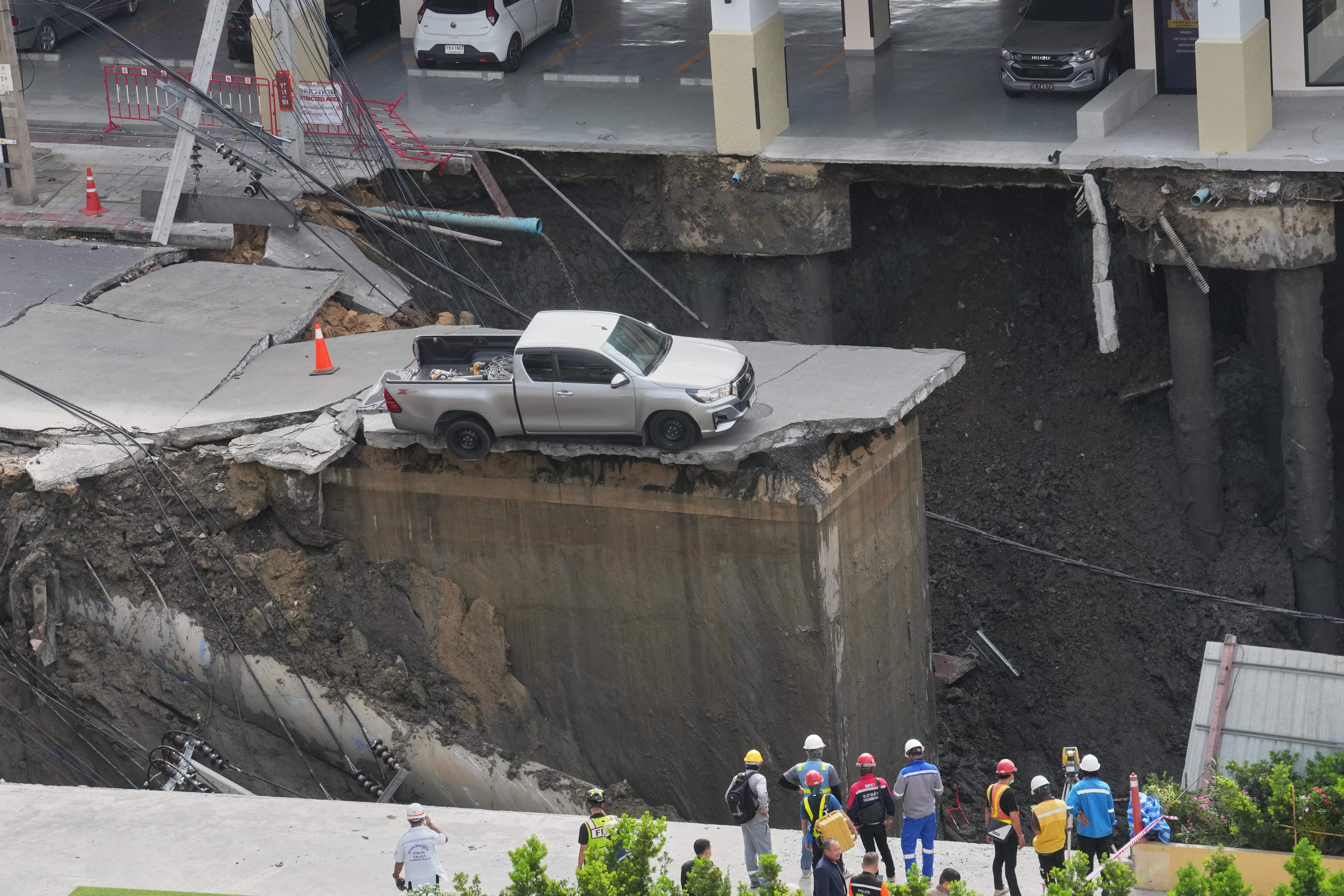 <p>Footage of the dramatic moment of the collapse showed the road surface slowly subsiding, pulling down several electricity poles and damaging water pipes. </p>
