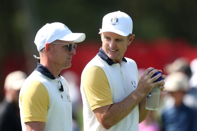 <p> Captain Luke Donald of Team Europe talks with Justin Rose </p>