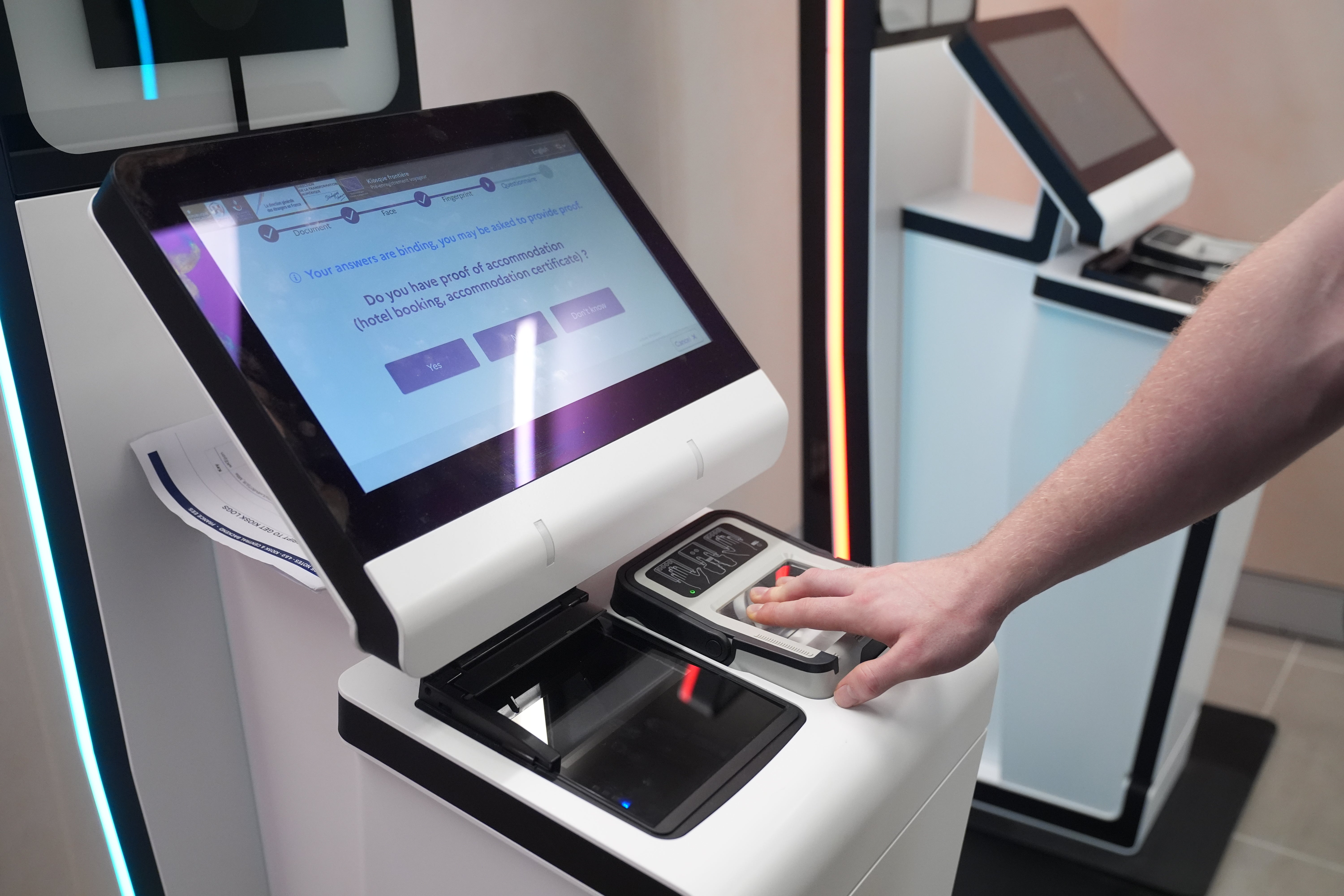 A person uses an EES kiosk during the preview at King’s Cross St Pancras before its rollout