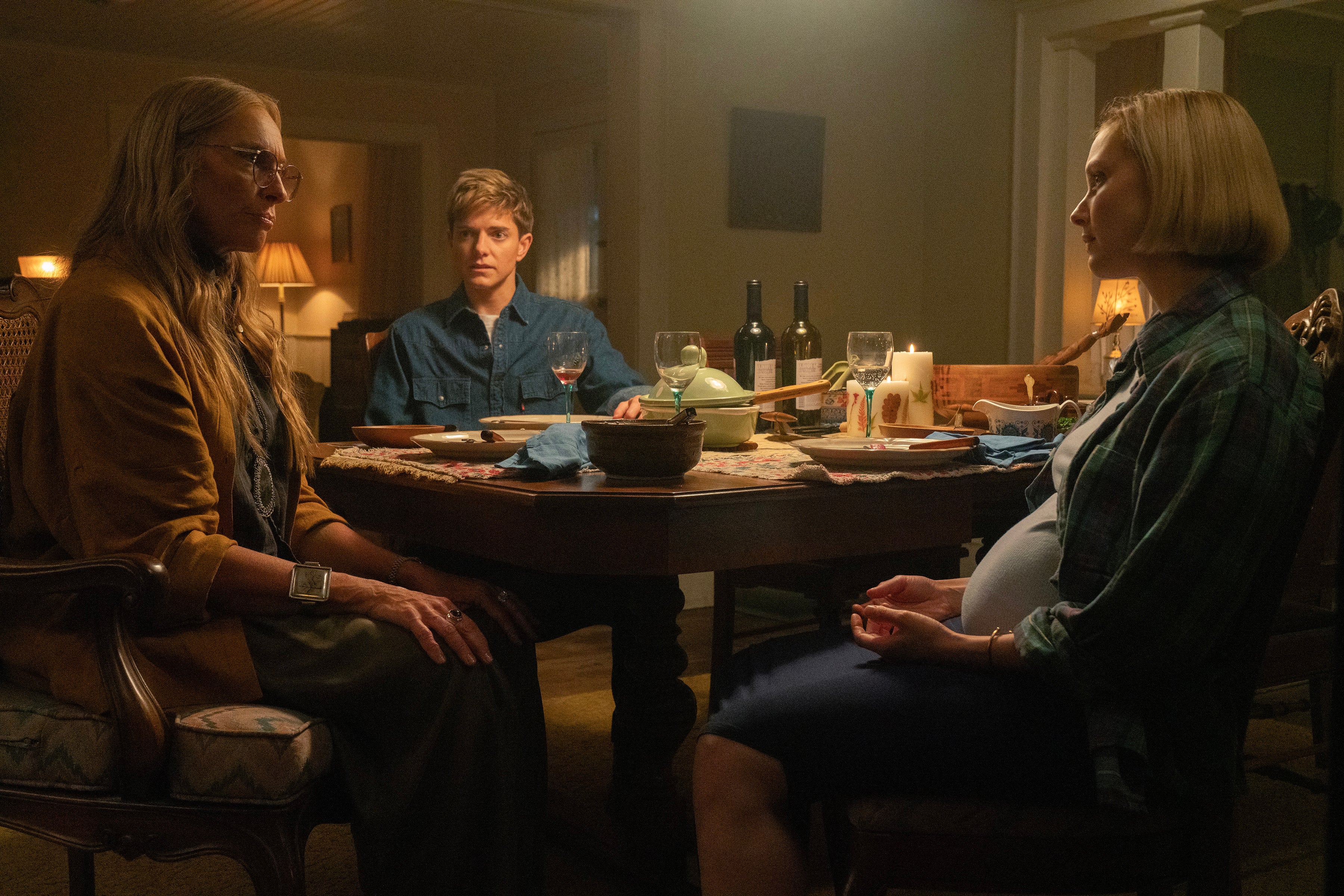 Trans cop Alex (Mae Martin, centre) moves to Tall Pines with pregnant wife Laura (Sarah Gadon)