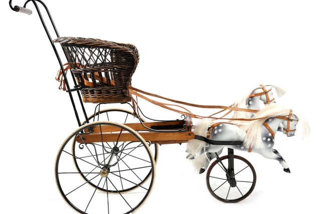Queen Victoria’s pushchair featured toy horses which move up and down (Woolley & Wallis/PA)