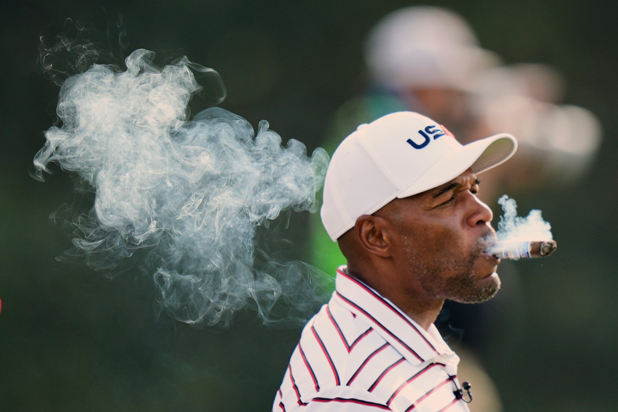 <p>United States' Michael Strahan smokes on the fifth hole during the celebrity Ryder Cup golf tournament. Michael has been married twice</p>