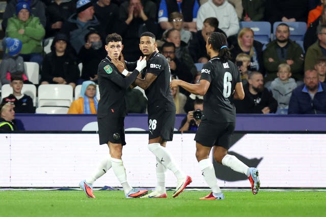 Phil Foden, left, celebrates scoring his goal (Nigel French/PA)