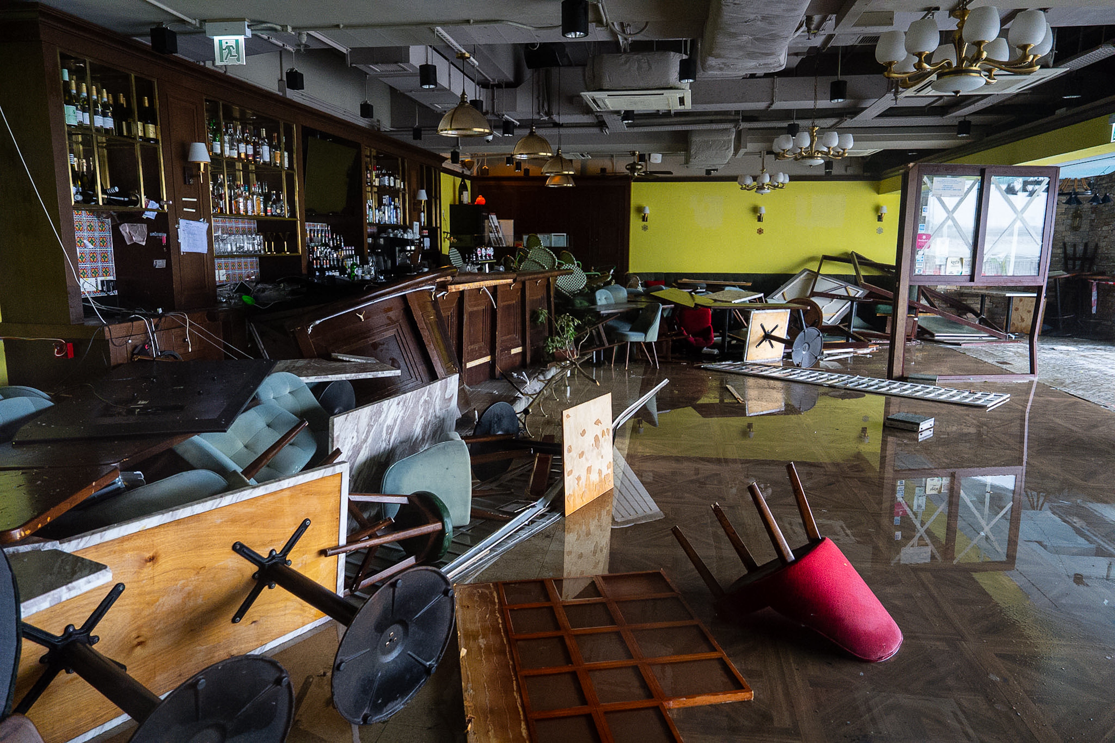 Furniture damaged by floodwater at a restaurant in Tseung Kwan O area, as super typhoon Ragasa approaches in Hong Kong