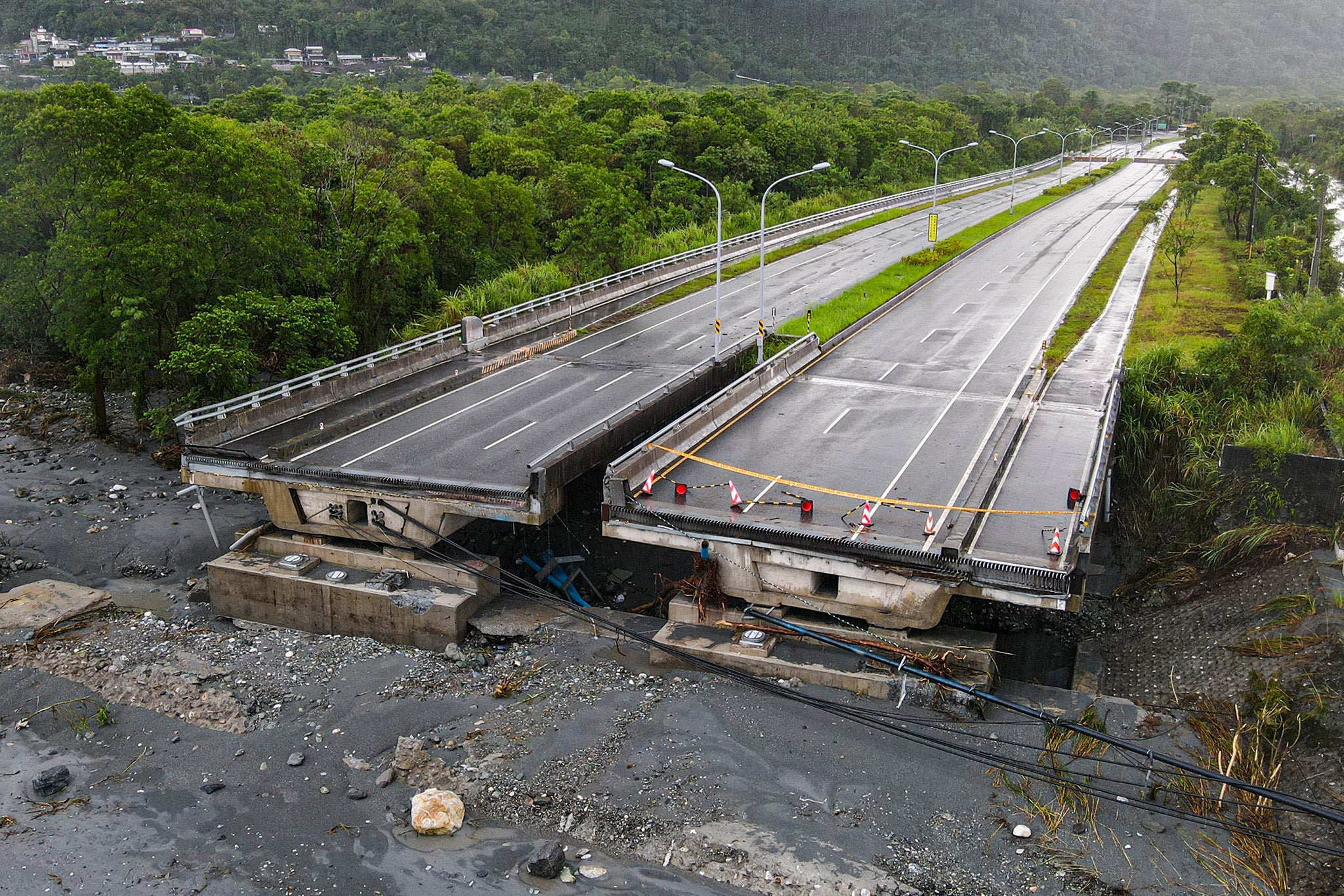 Part of the bridge over Mataian Creek is seen damaged after a barrier lake burst in Hualien in Taiwan