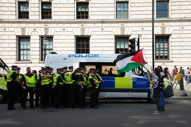 <p>Police officers and demonstrators during a Lift the Ban on Palestine Action protest earlier in September</p>
