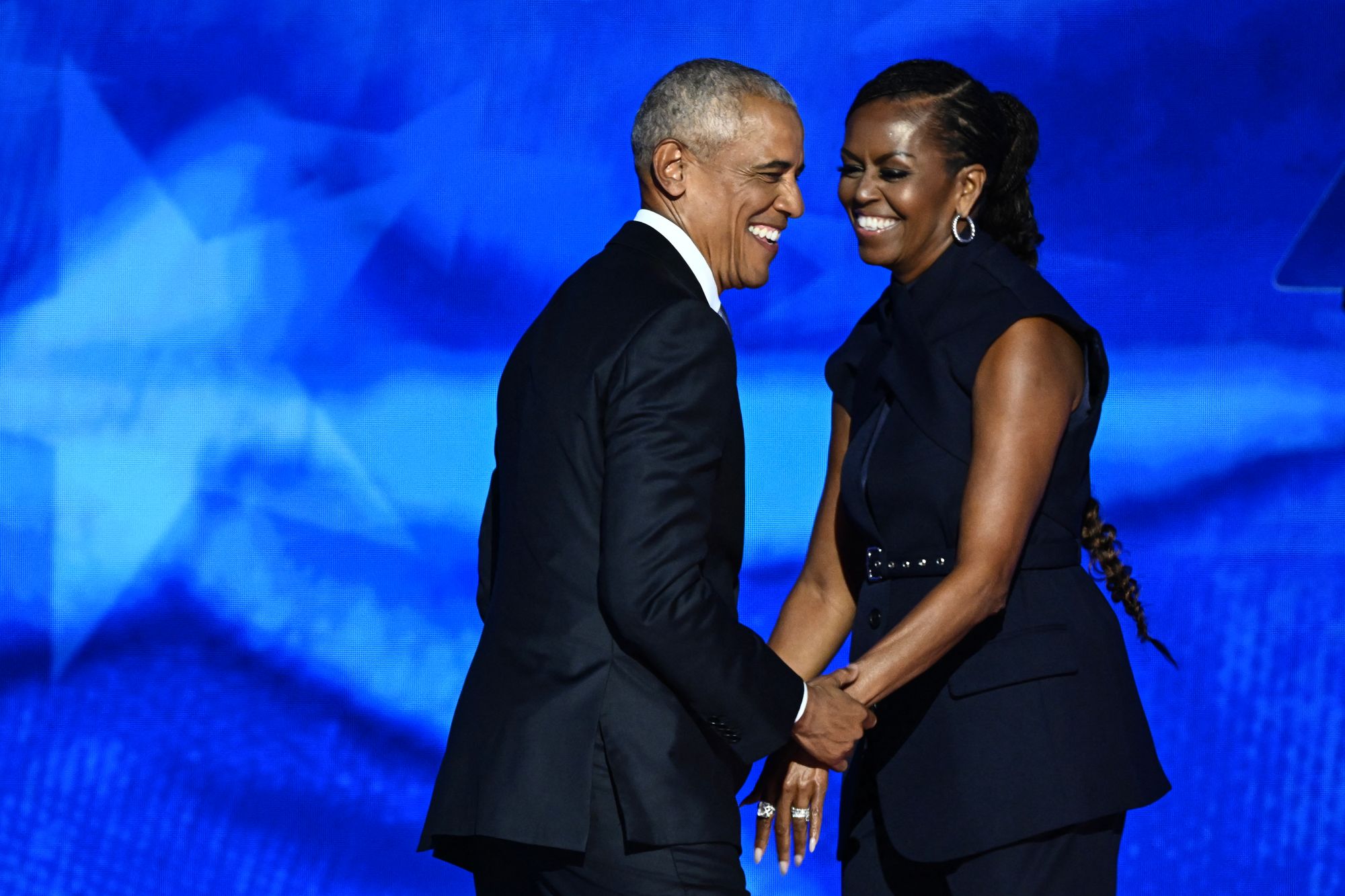 <p>Former US President Barack Obama arrives onstage after his wife and former First Lady Michelle Obama introduced him on the second day of the Democratic National Convention (DNC) at the United Center in Chicago, Illinois, on August 20, 2024. </p>