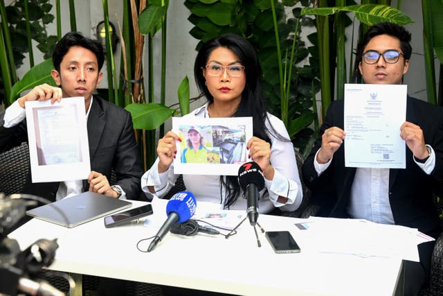 <p>The legal team for the family of Australian national Byron Haddow hold up documents during a press conference at the Tibubeneng Badung regency on Indonesia's resort island of Bali on 24 September 2025</p>